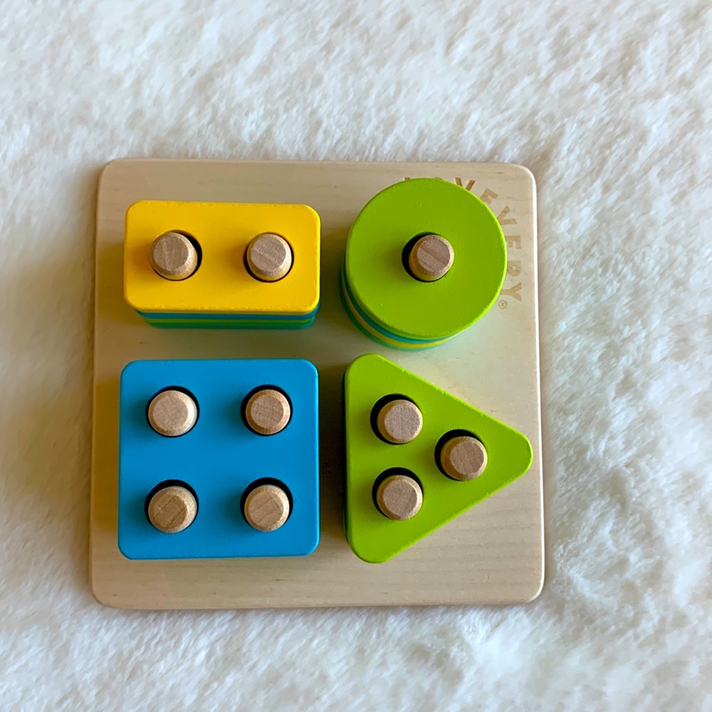 Lovevery Sort and Stack Peg Puzzle from the Enthusiast Play Kit Months 28-30.